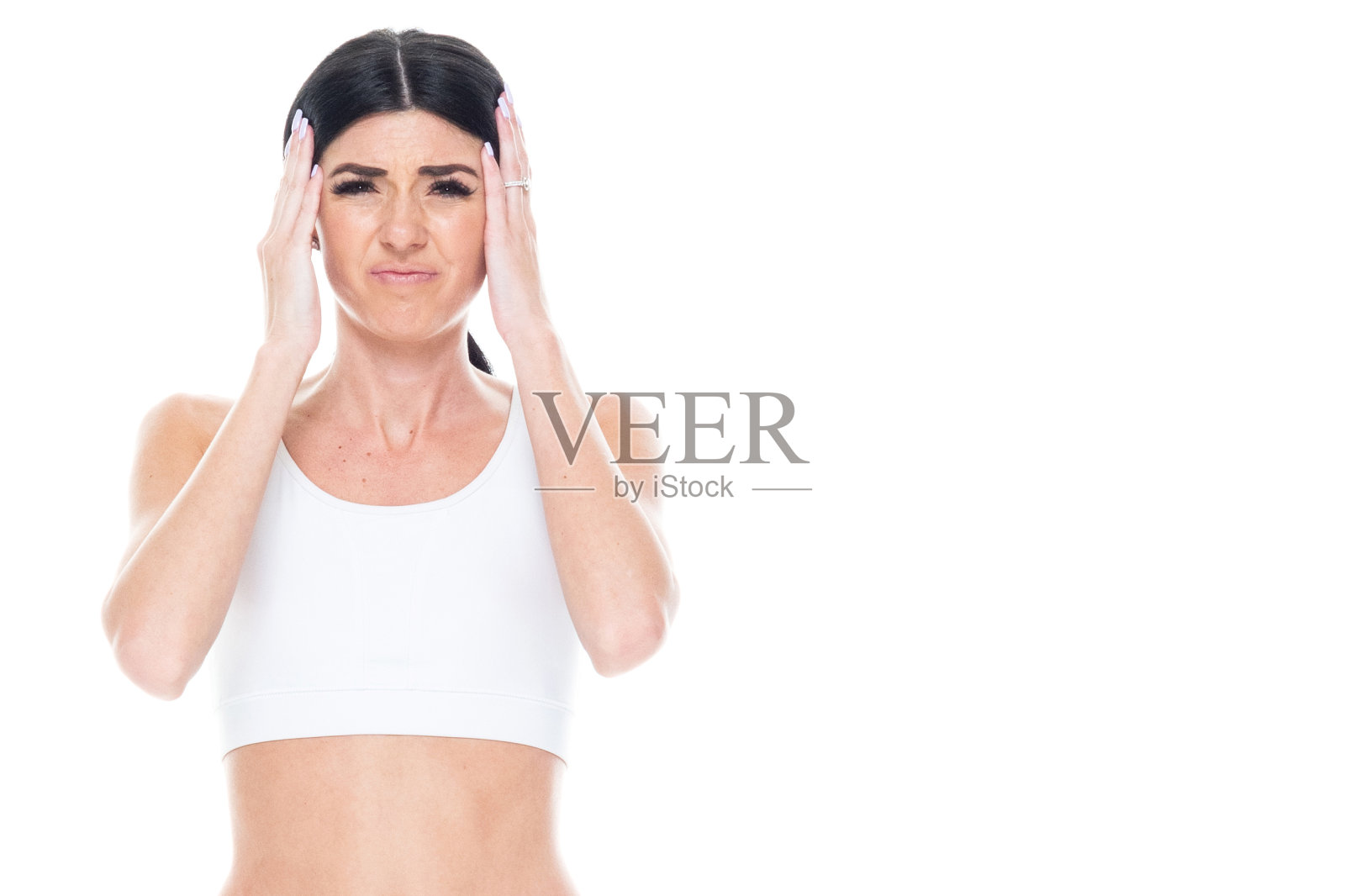 迷人的活跃女性在运动服装-头痛照片摄影图片