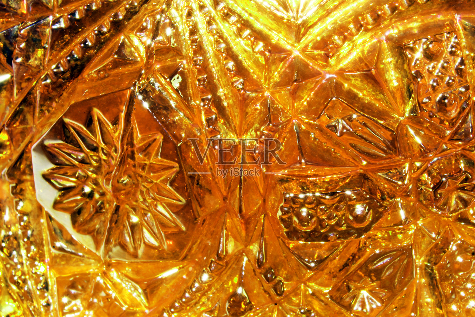 橙色红色切割玻璃宏镇纸形状和气泡照片摄影图片