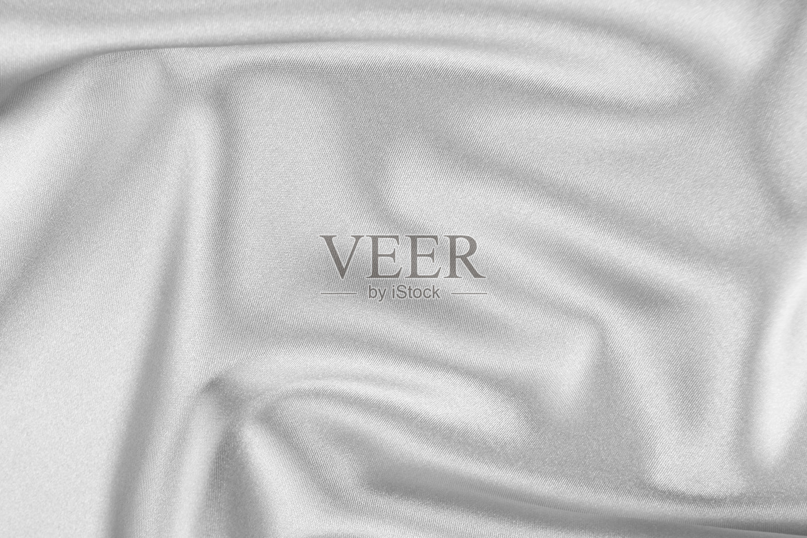 以白色为背景的缎纹织物的纹理照片摄影图片