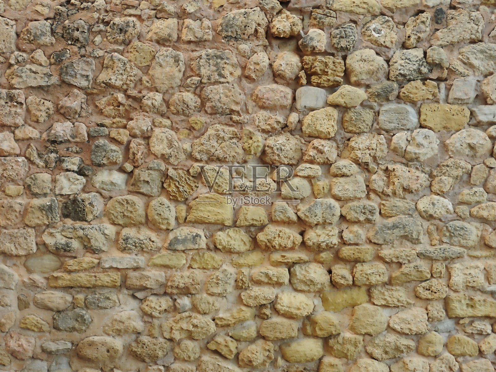 由天然石头制成的旧墙照片摄影图片