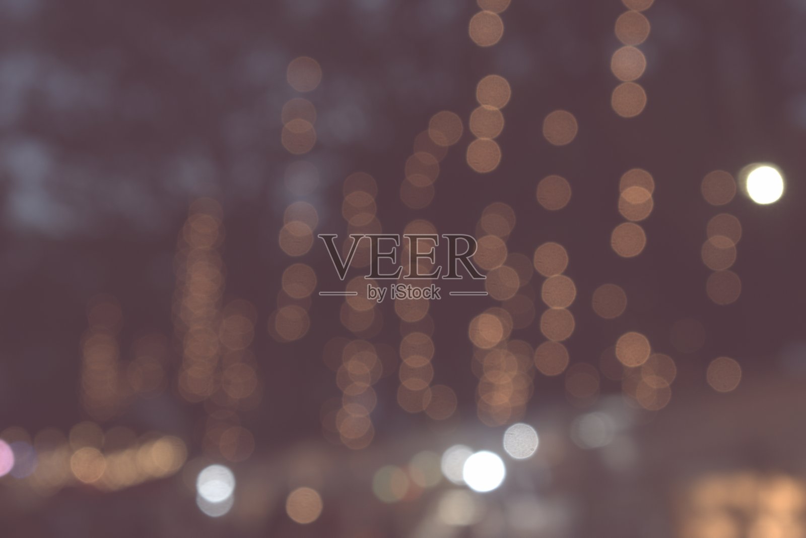 模糊的散景金色灯光在公园里，模糊的背景照片摄影图片