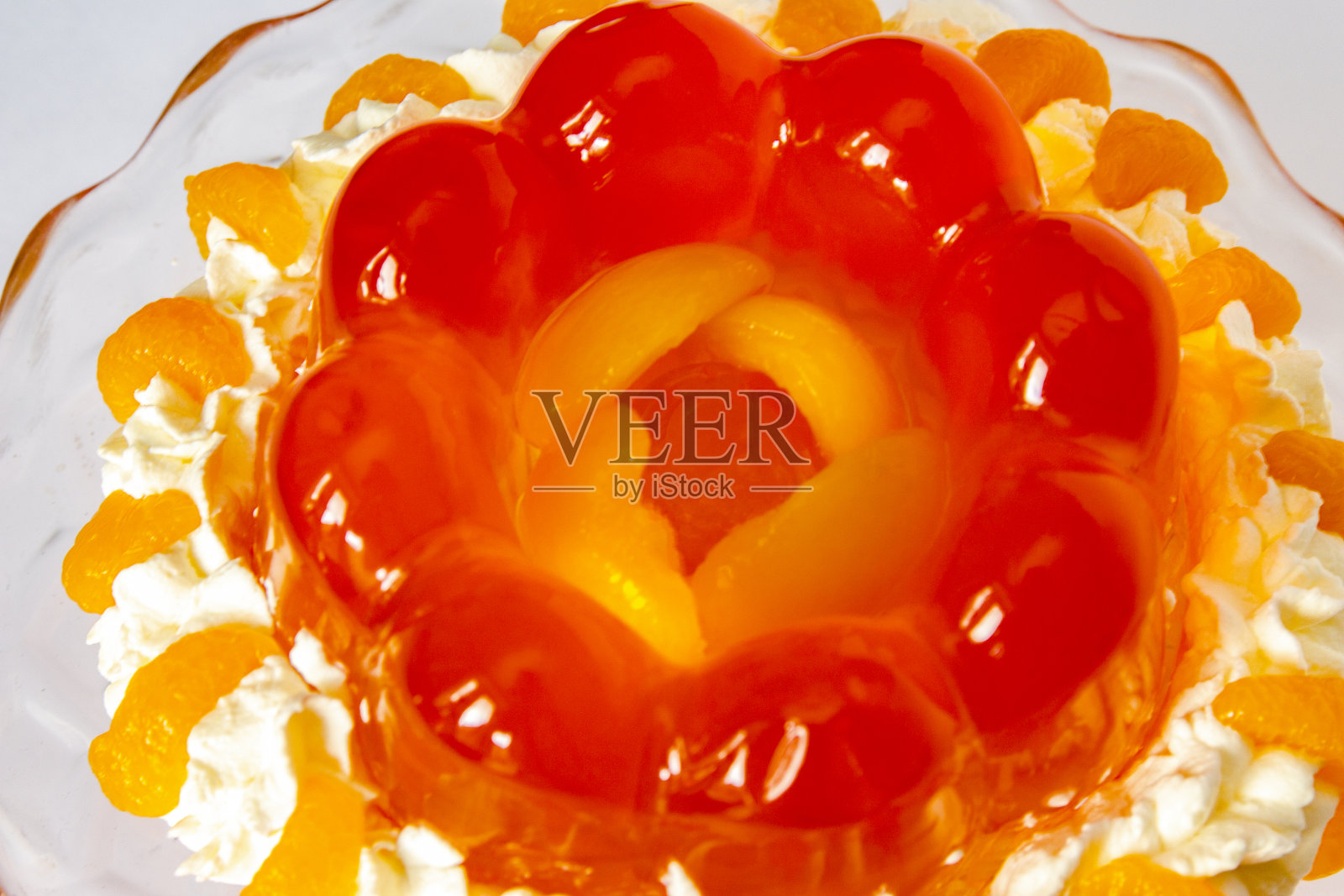 接近半透明的令人垂涎的橙子果冻模具照片摄影图片