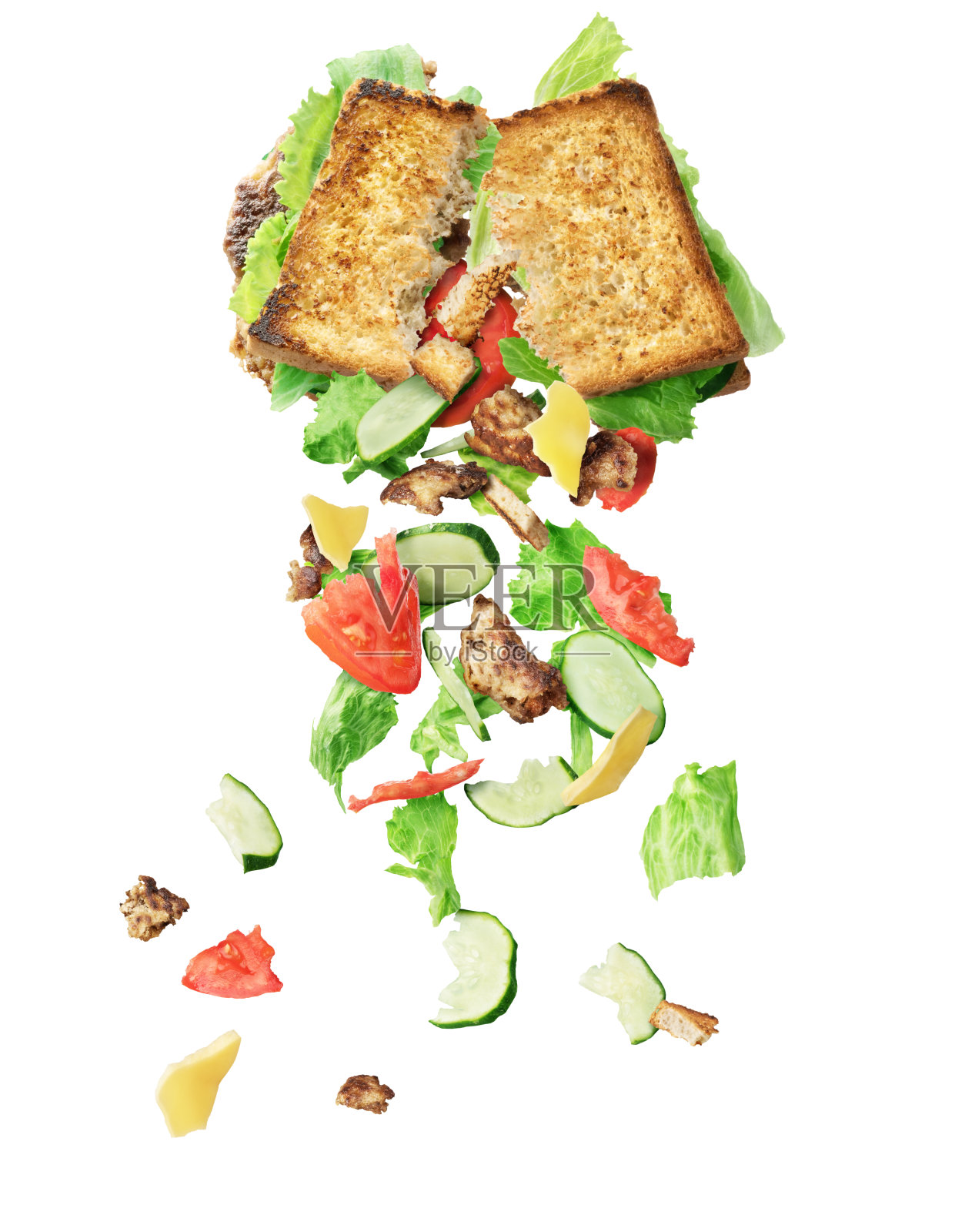 配料从一个破碎的三明治中飞出来，孤立在白色的背景上照片摄影图片