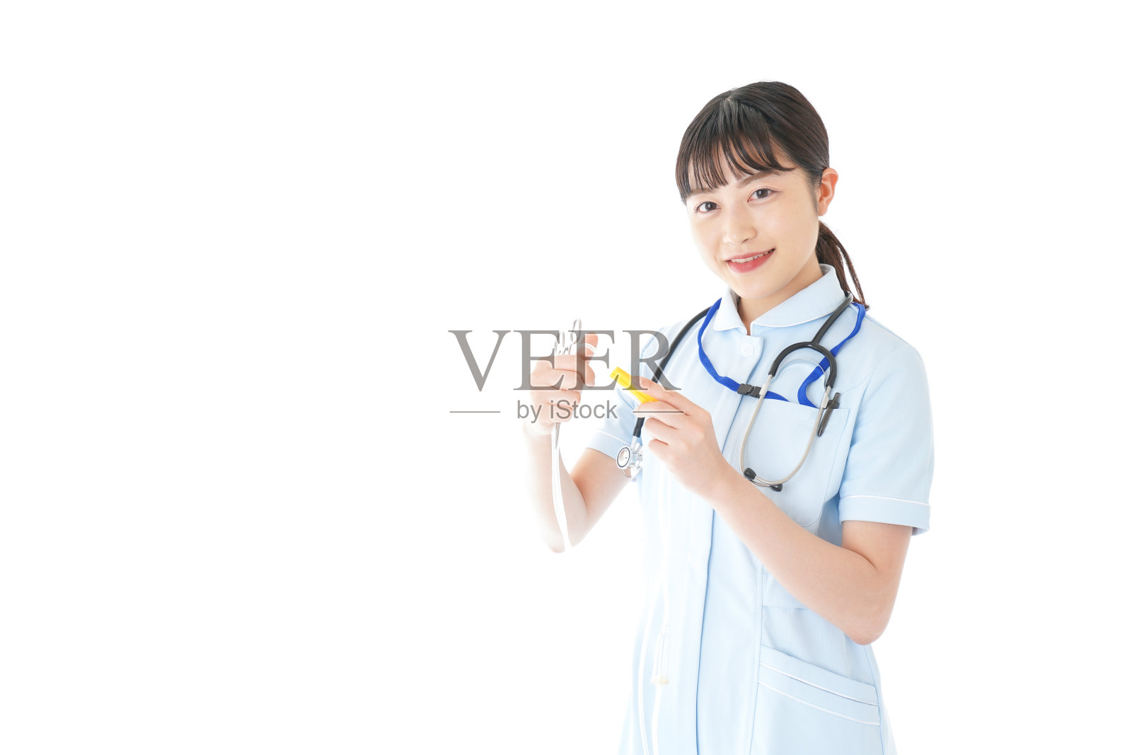 年轻护士使用医疗设备照片摄影图片