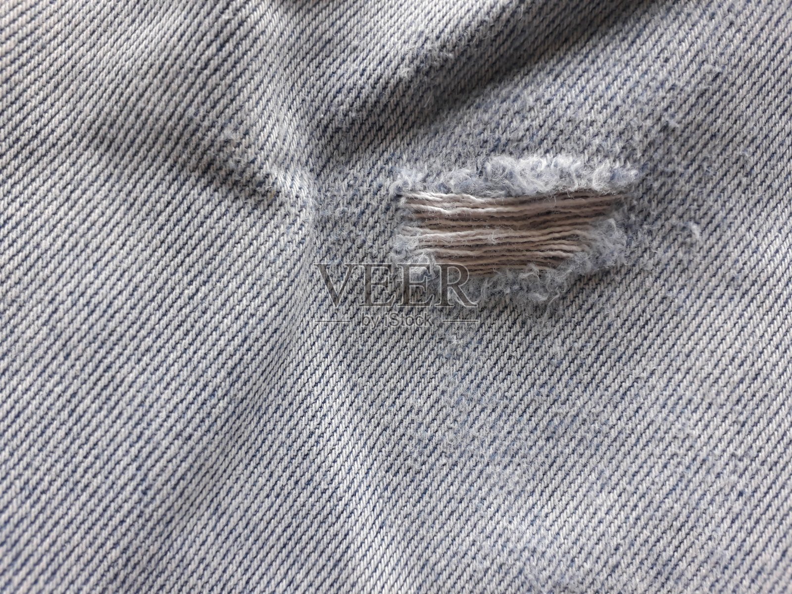 织物表面的牛仔裤。照片摄影图片