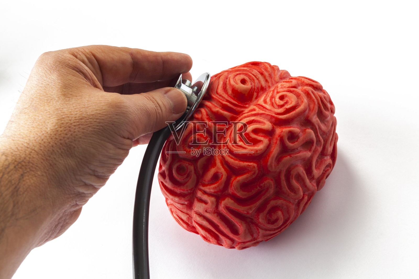 听诊器，手和脑照片摄影图片