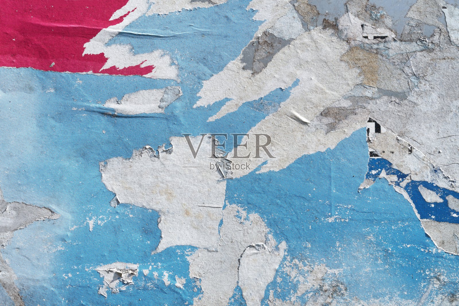 墙上撕破的海报照片摄影图片