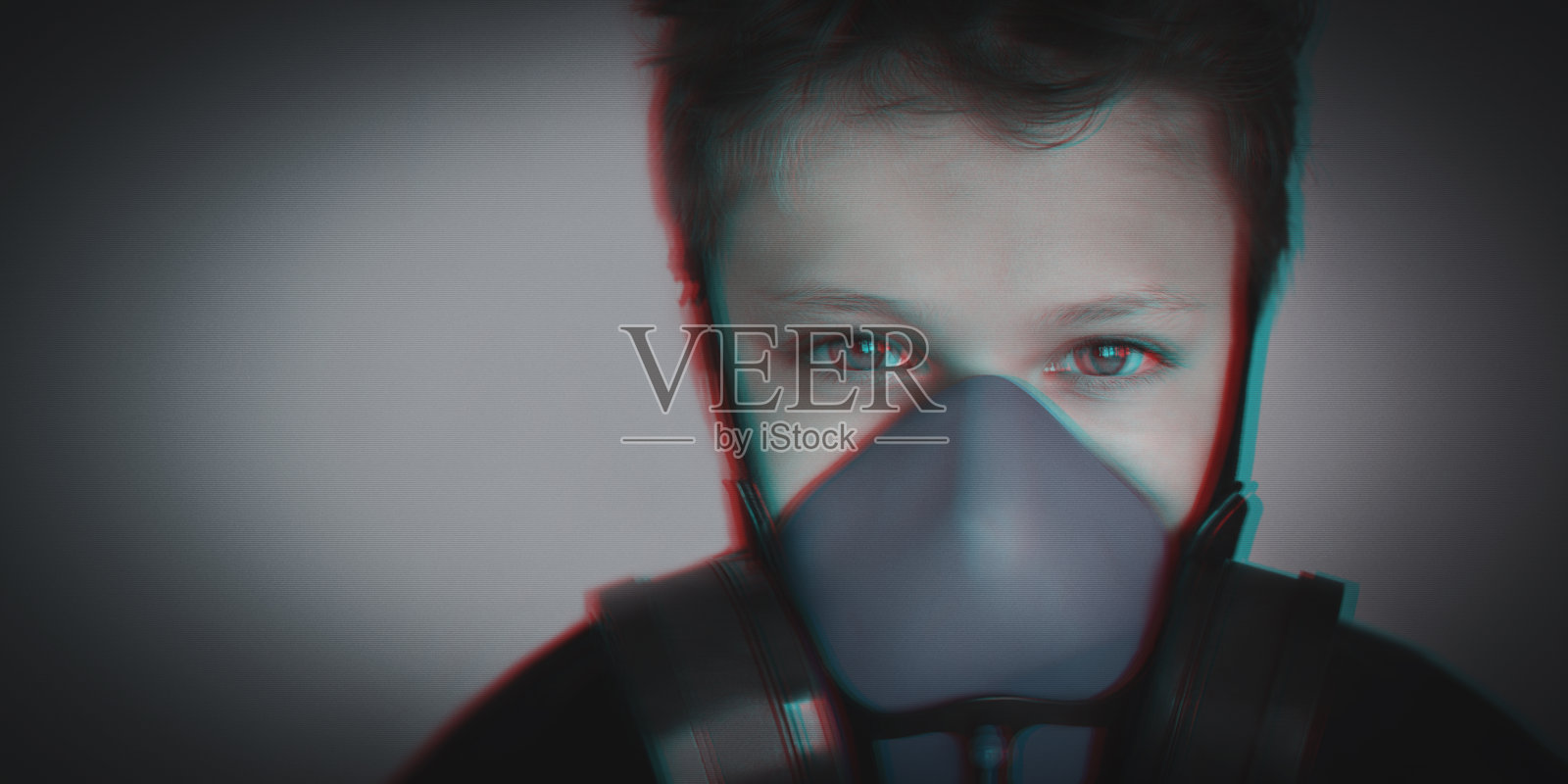 小男孩戴着防毒面具、呼吸器画像照片摄影图片