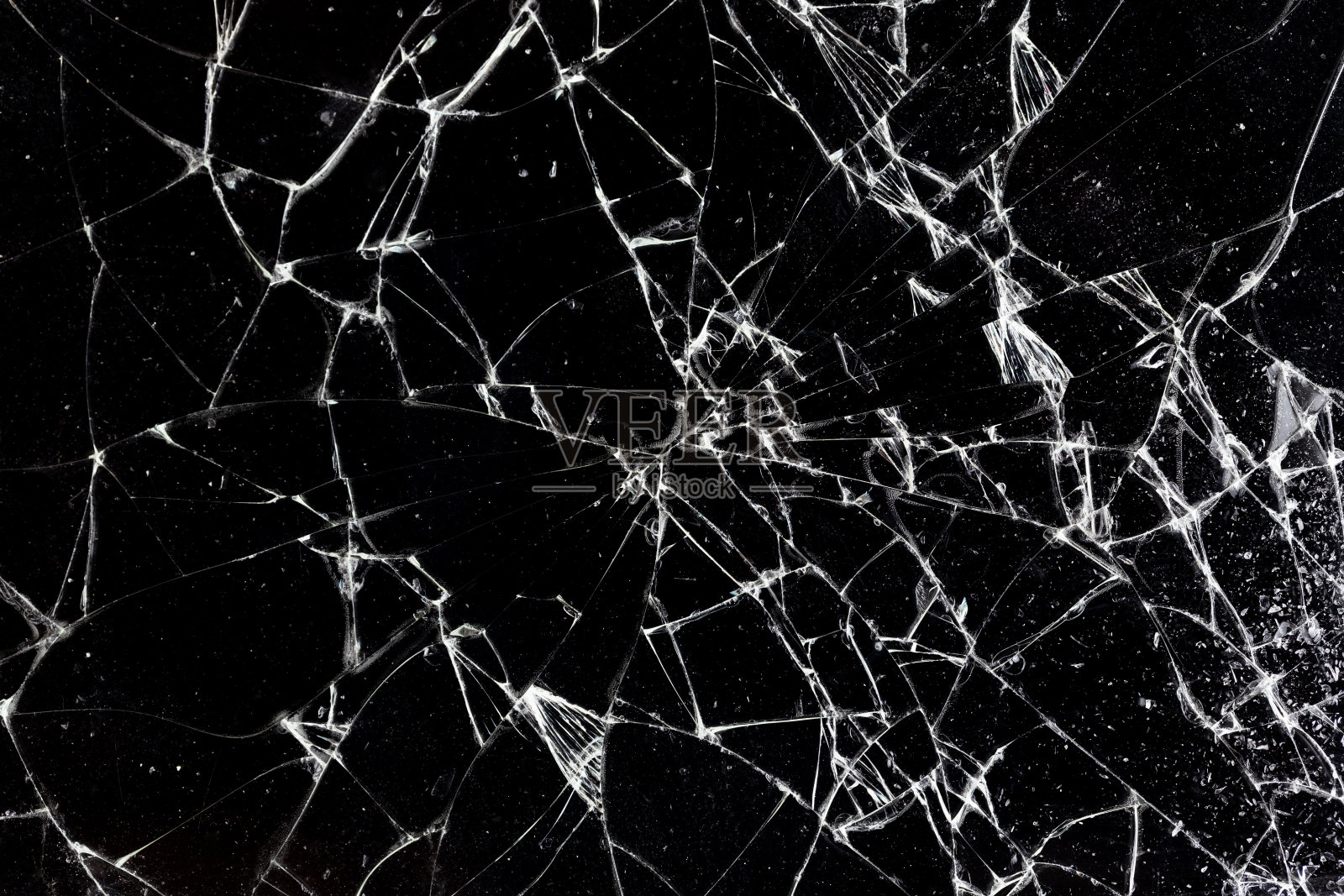 破碎的玻璃质地。摘要智能手机屏幕因震动而碎裂。照片摄影图片