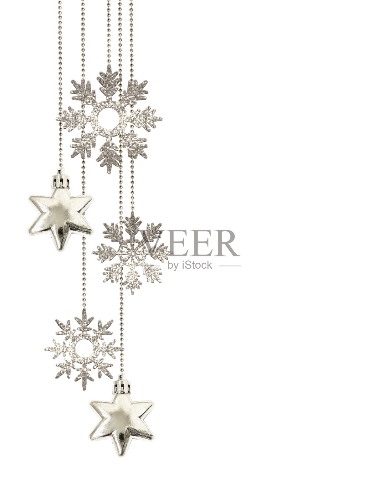 圣诞节的安排，挂着装饰银星和闪闪发光的雪花照片摄影图片