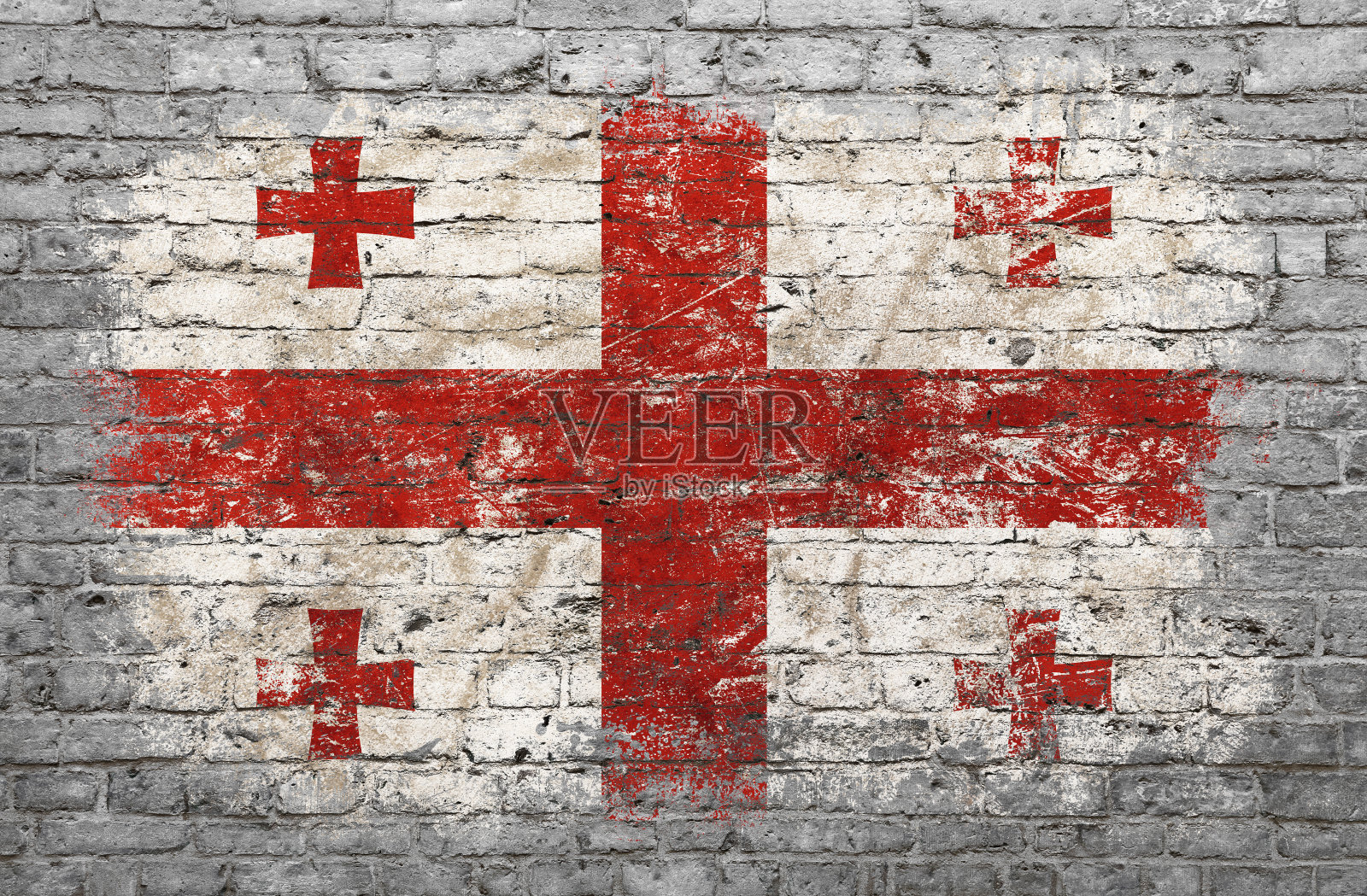 砖墙上画着乔治亚旗照片摄影图片