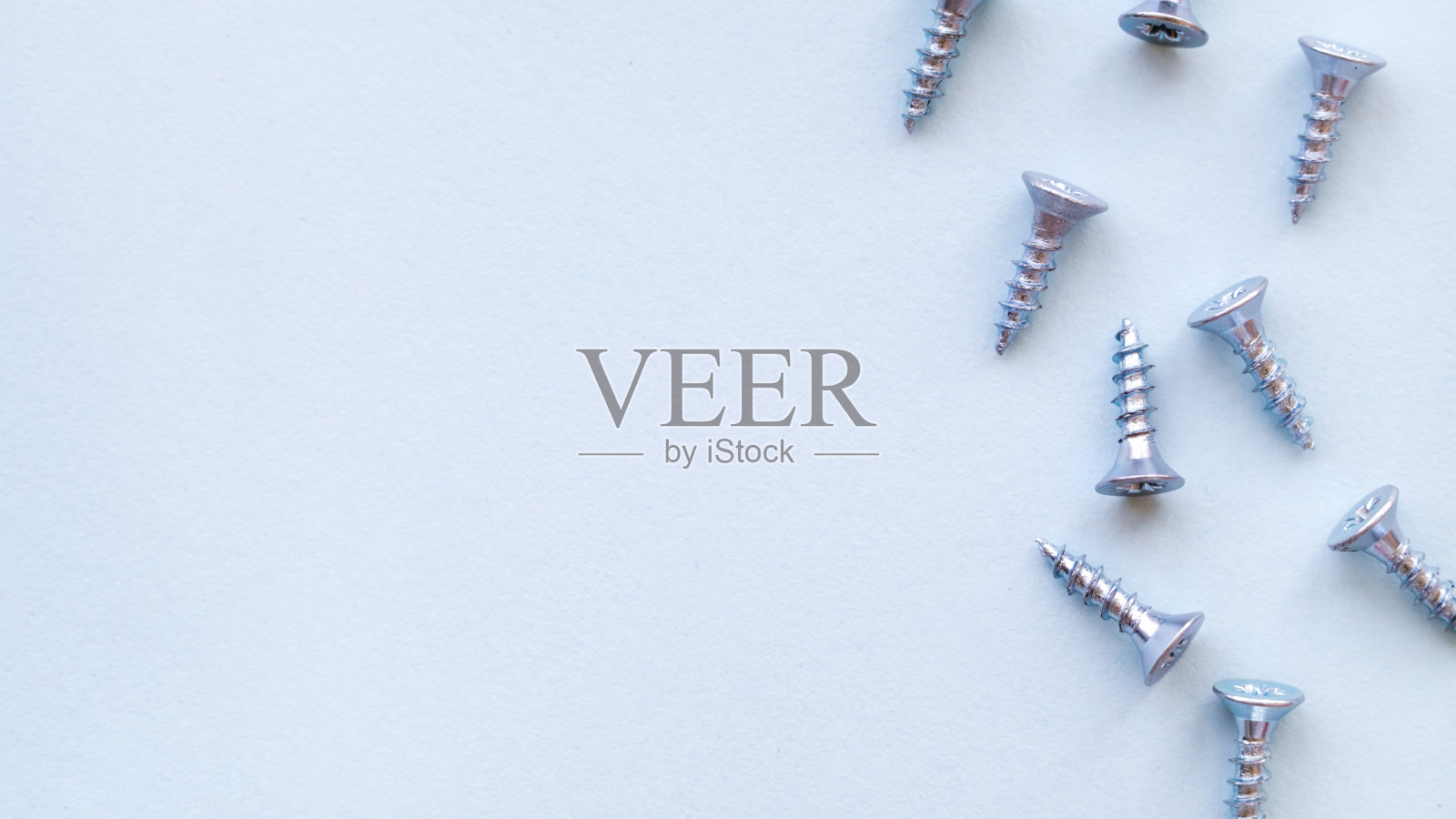 自攻螺钉上的蓝色背景特写。照片摄影图片