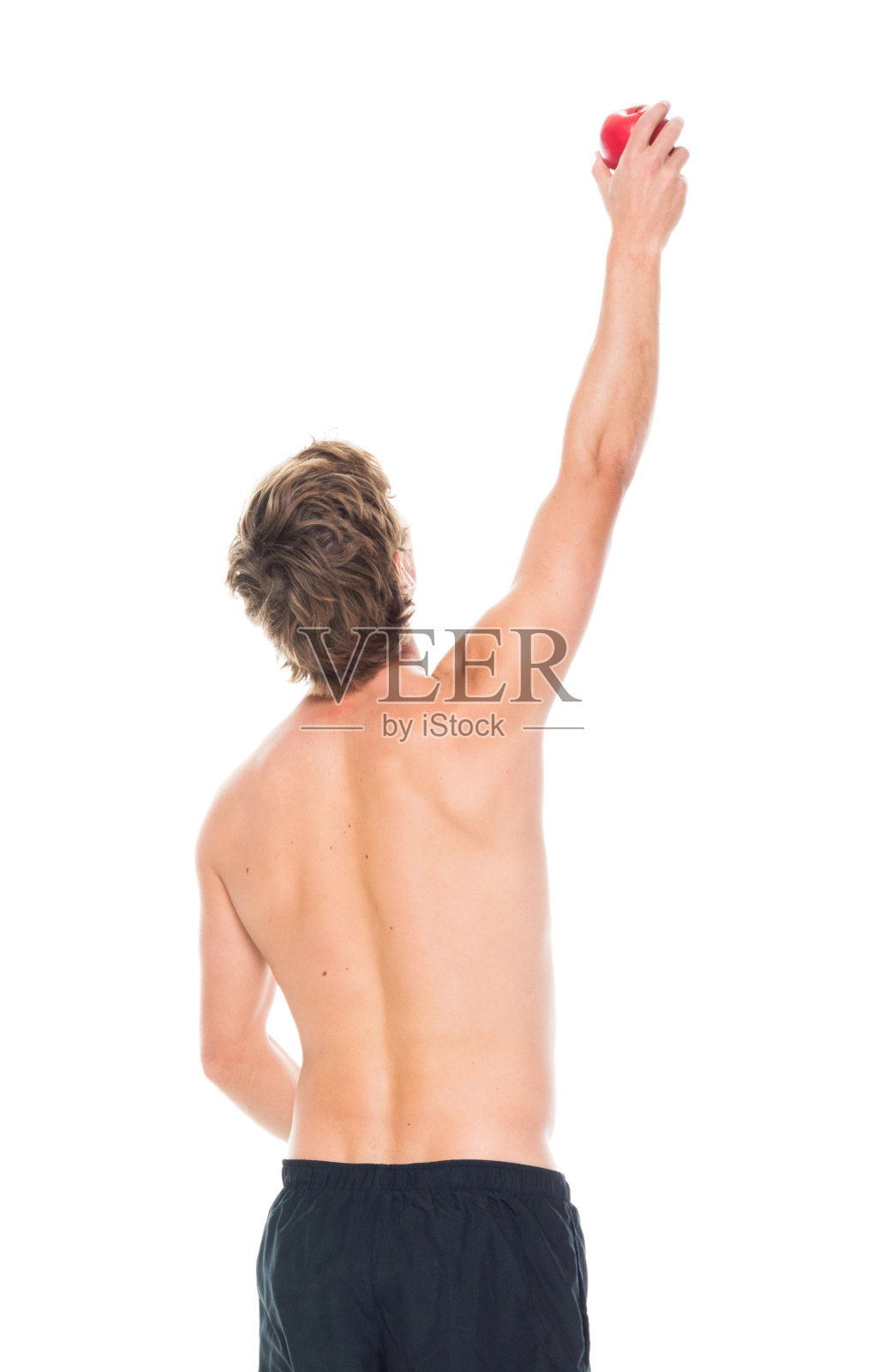 迷人的赤膊男子在运动服装持有水果照片摄影图片