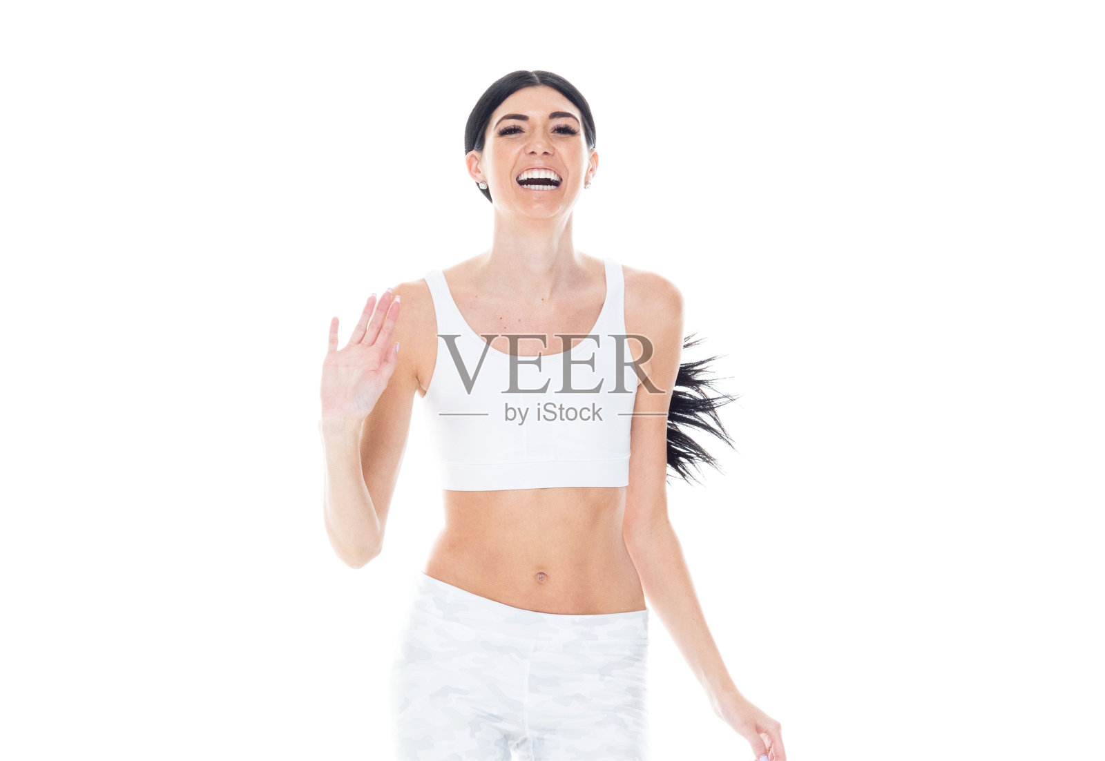 高大美丽的女性穿着运动服-跑步和挥手照片摄影图片