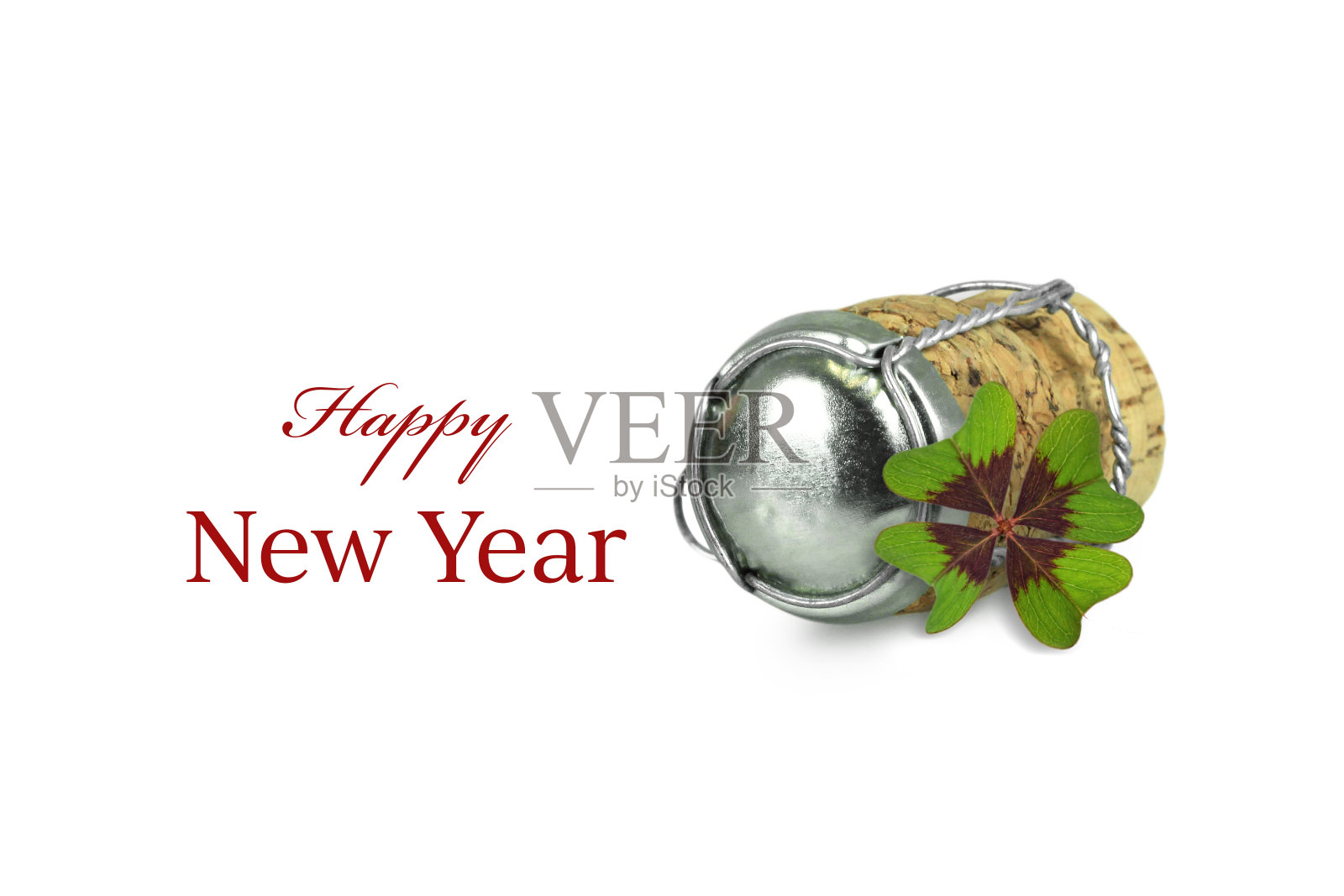 新年快乐。香槟软木塞和三叶草孤立在白色背景照片摄影图片