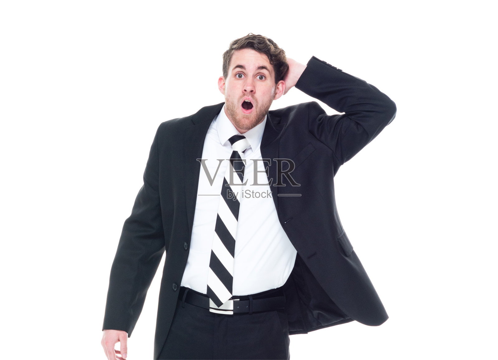 一个人/看相机/正面视图/腰部以上的20-29岁的成年英俊的人高加索青年男子/男性商人/商人/经理站在白色背景穿着西装谁是震惊/惊讶照片摄影图片