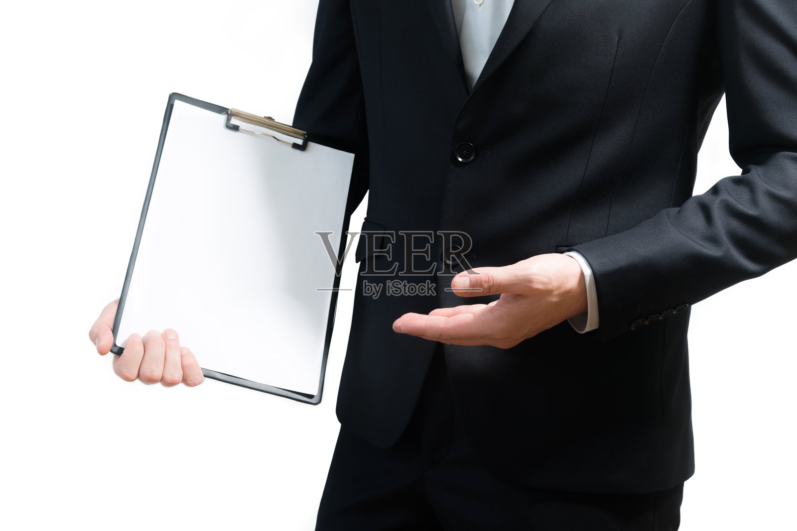 年轻的商人穿着西装，手里拿着牌子，剪报路径，文字空间照片摄影图片