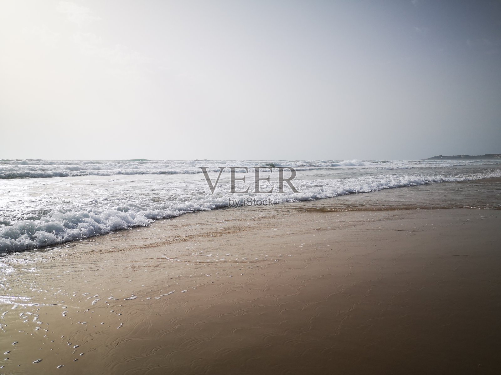 海浪和沙滩照片摄影图片