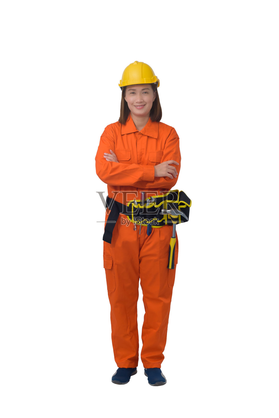 建筑工人穿着橙色防护服，头盔上有工具带隔离在白色背景上照片摄影图片