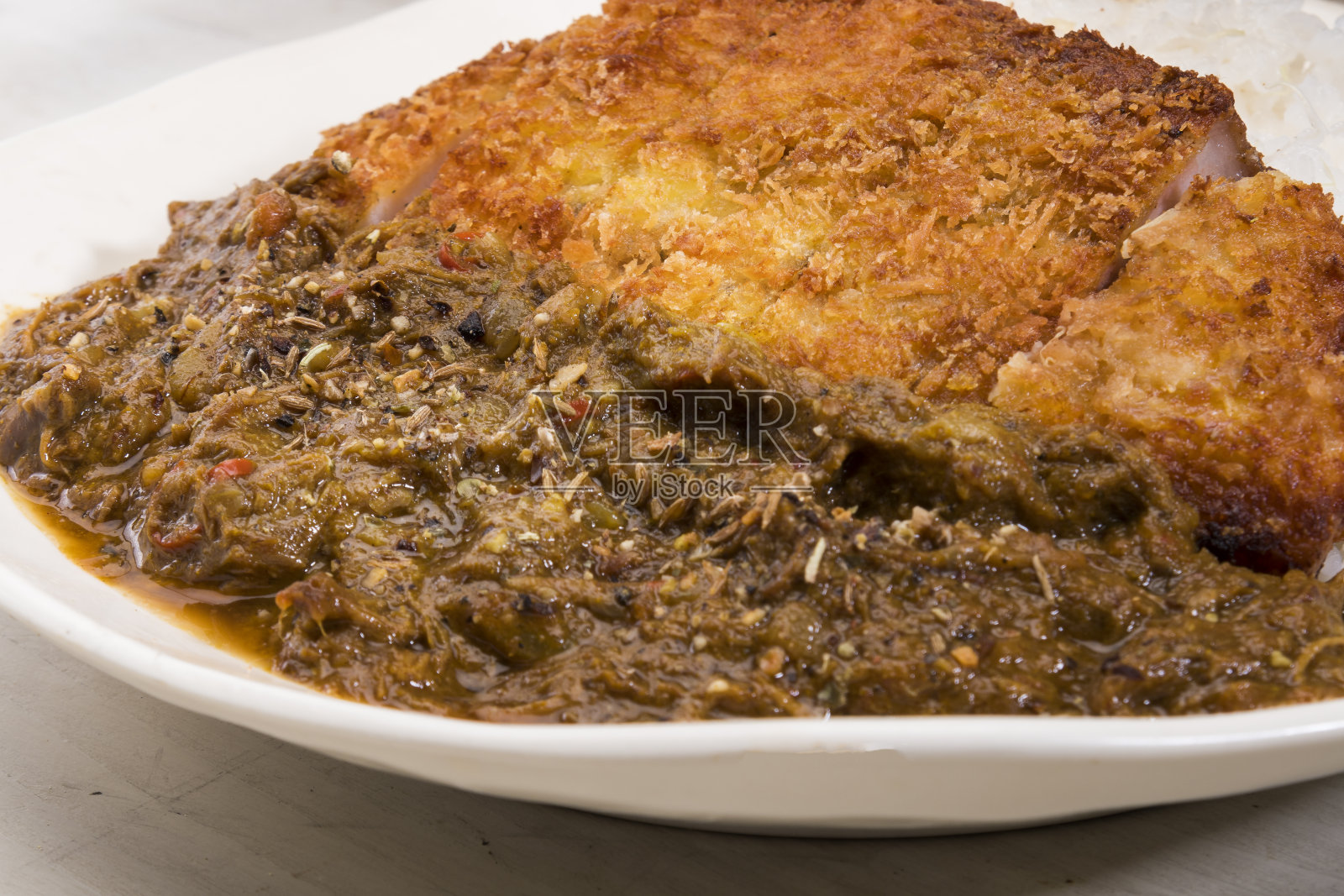 咖喱辣炸肉排照片摄影图片