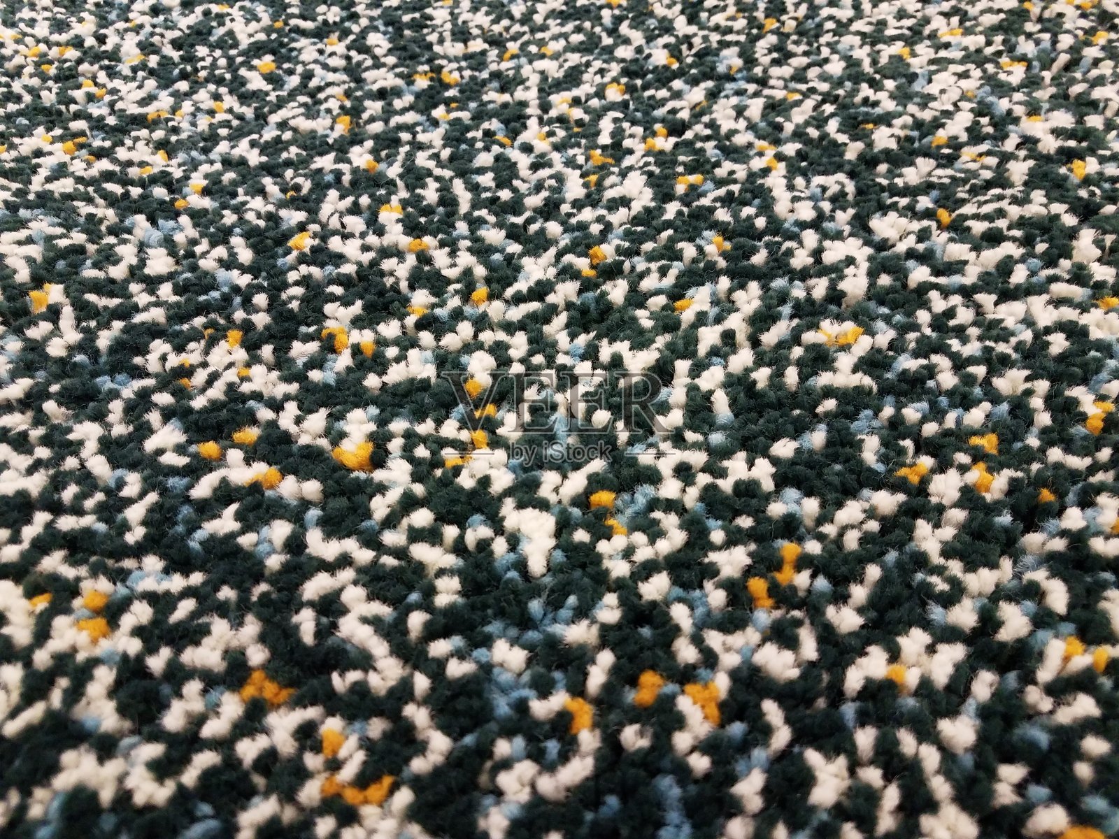 黑色、白色、黄色和蓝色的地毯照片摄影图片