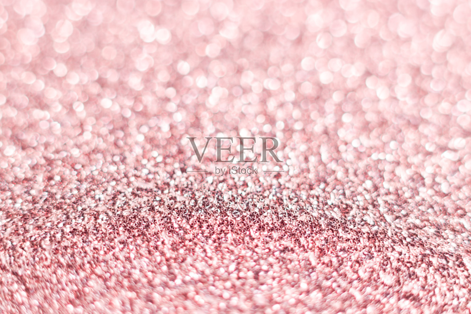 粉色亮片纹理节日闪闪发光的亮片背景特写。情人节、新年或圣诞节用的纸照片摄影图片