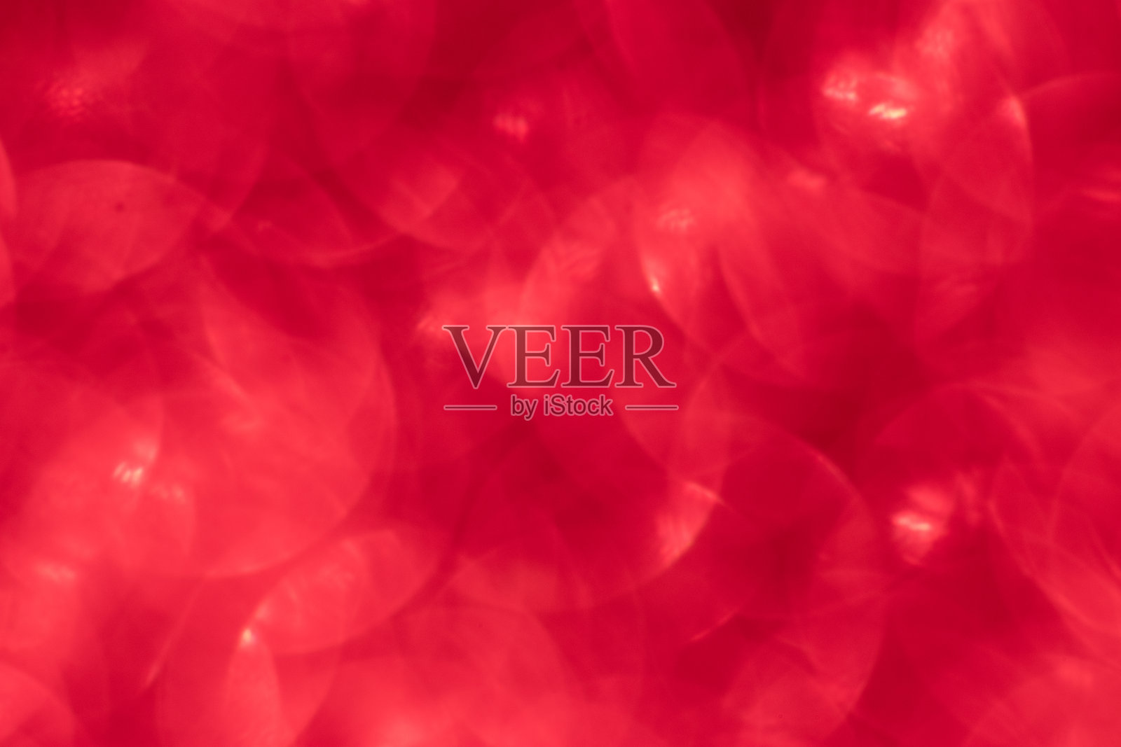 红色闪烁的节日背景与散景灯。庆祝概念的节日和周年照片摄影图片