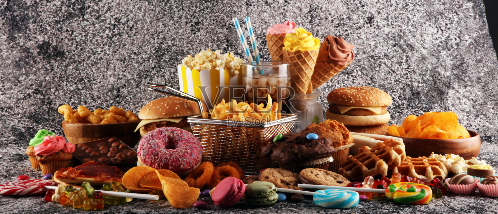 不健康的产品。对身材、皮肤、心脏和牙齿有害的食物。照片摄影图片