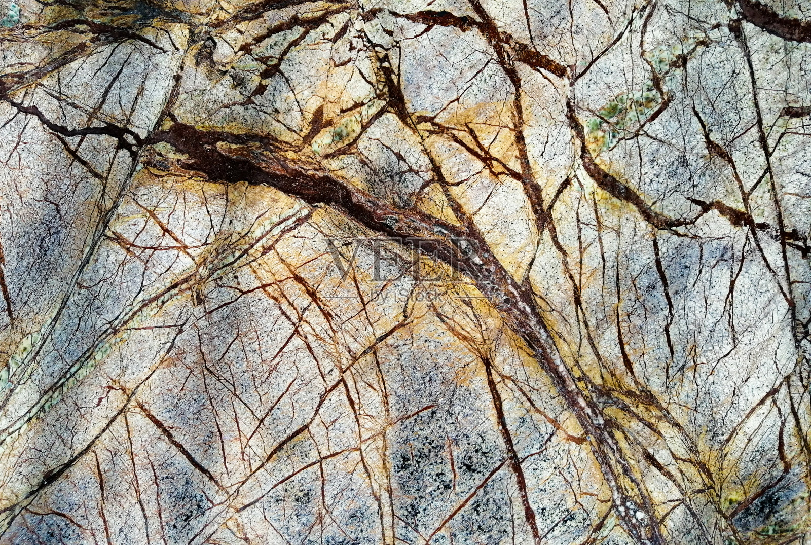 黄蓝色大理石纹理，带有深色条纹。近距离照片摄影图片