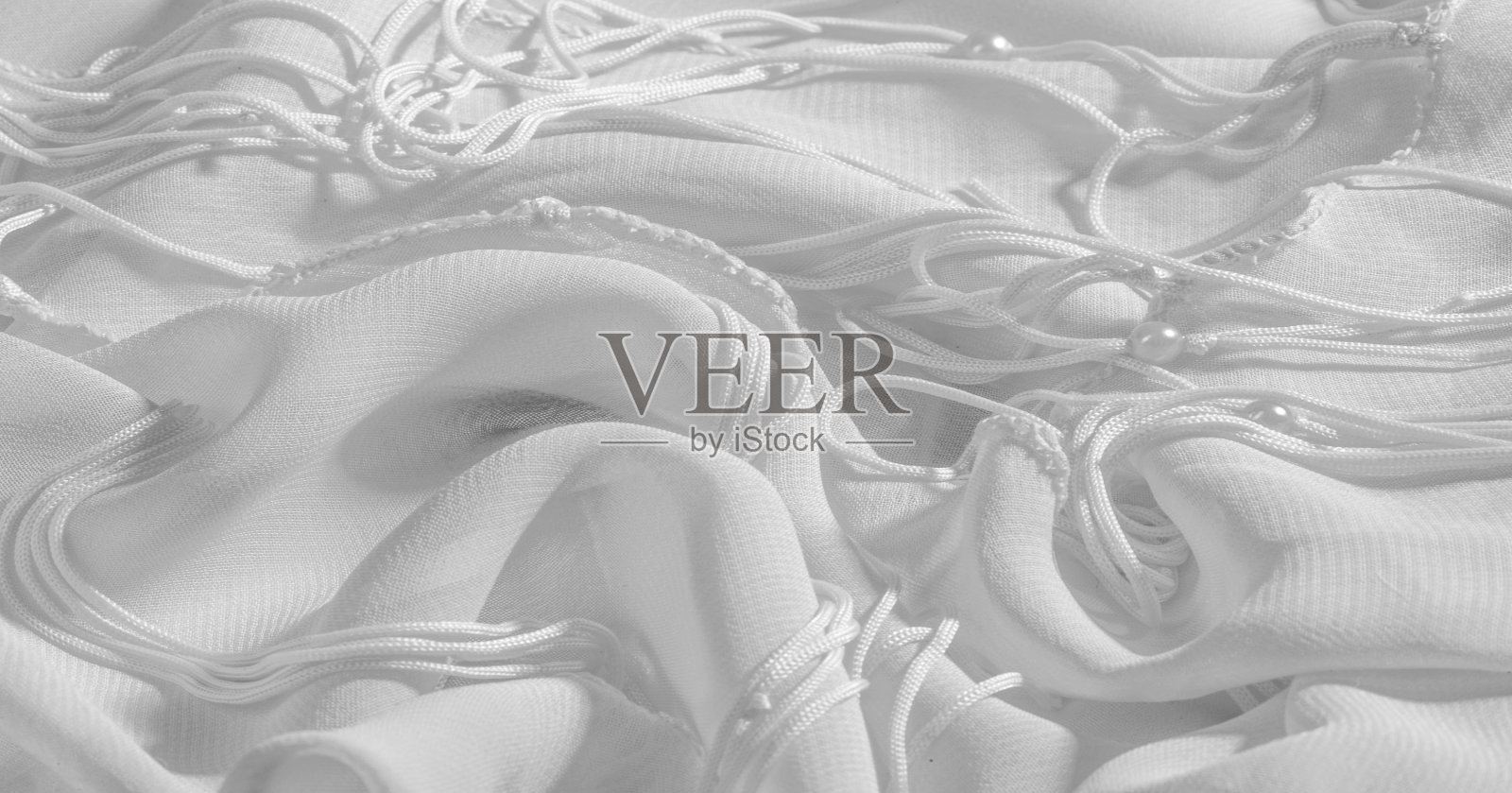 背景、图案、纹理、墙纸、白色丝织品都有一种灿烂的光泽。这是用途最广的布料。你的设计要有创意。照片摄影图片
