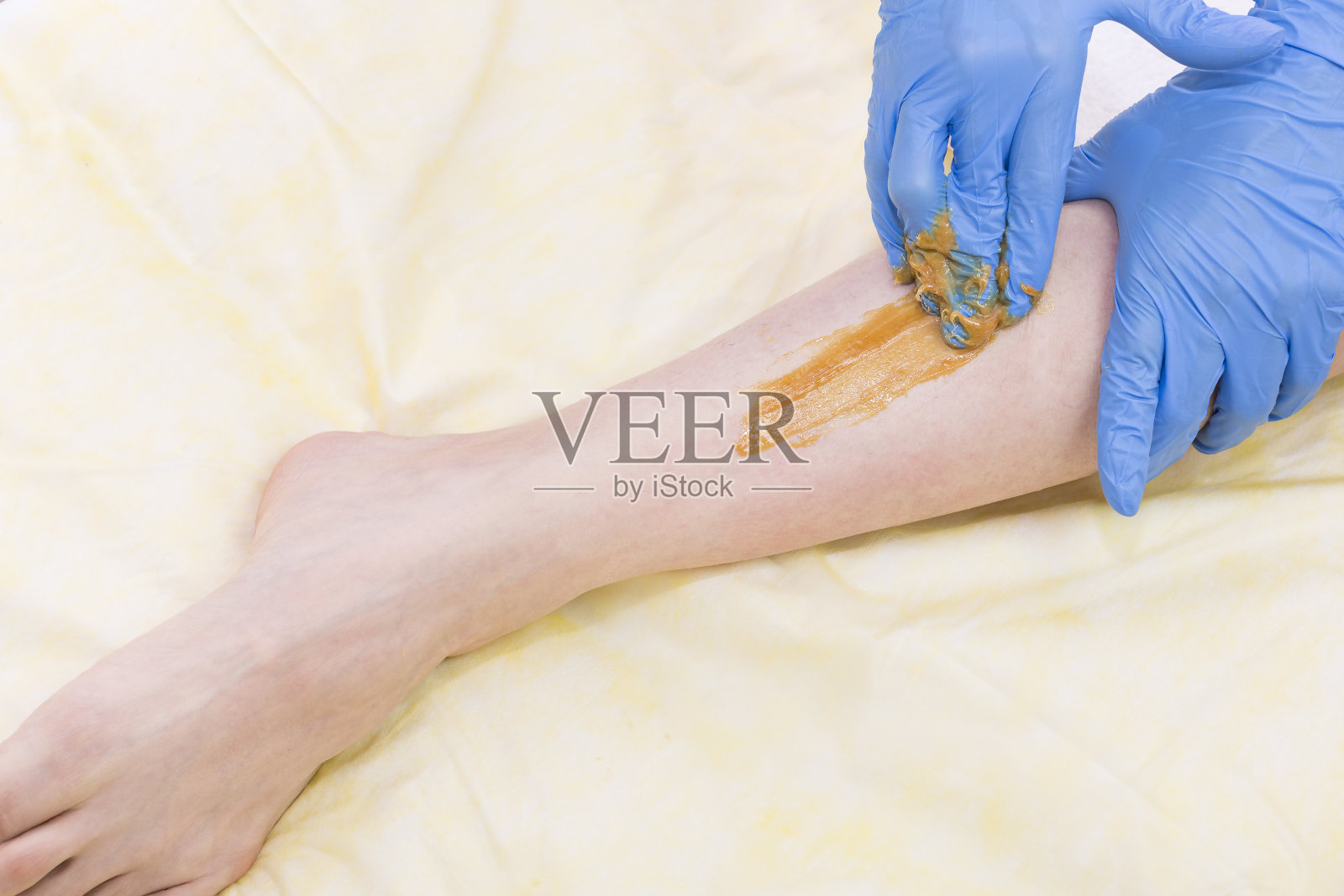 身体护理程序清洁脱毛糖美容院。照片摄影图片