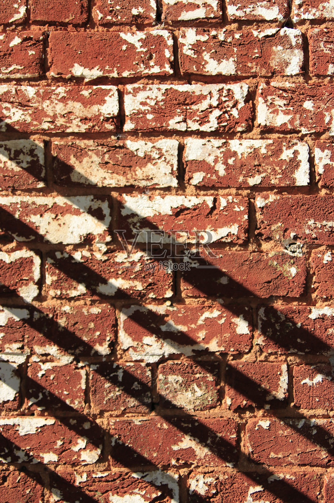 风化砖墙和斜阴影照片摄影图片