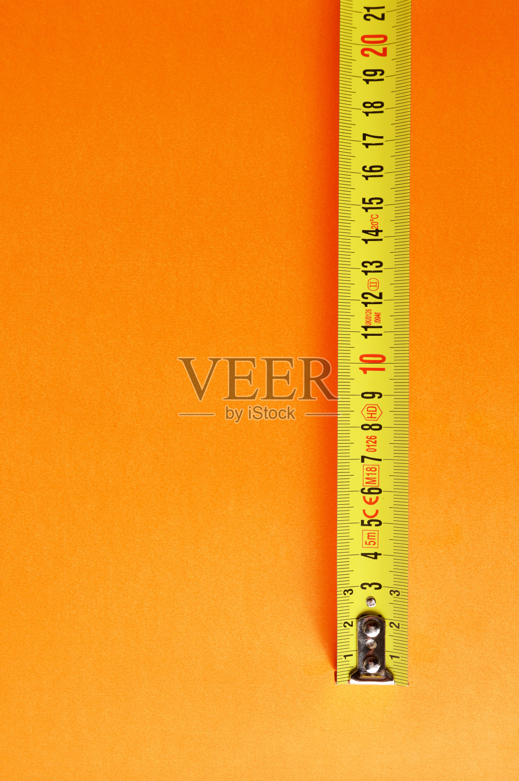 卷尺测量橙色背景照片摄影图片