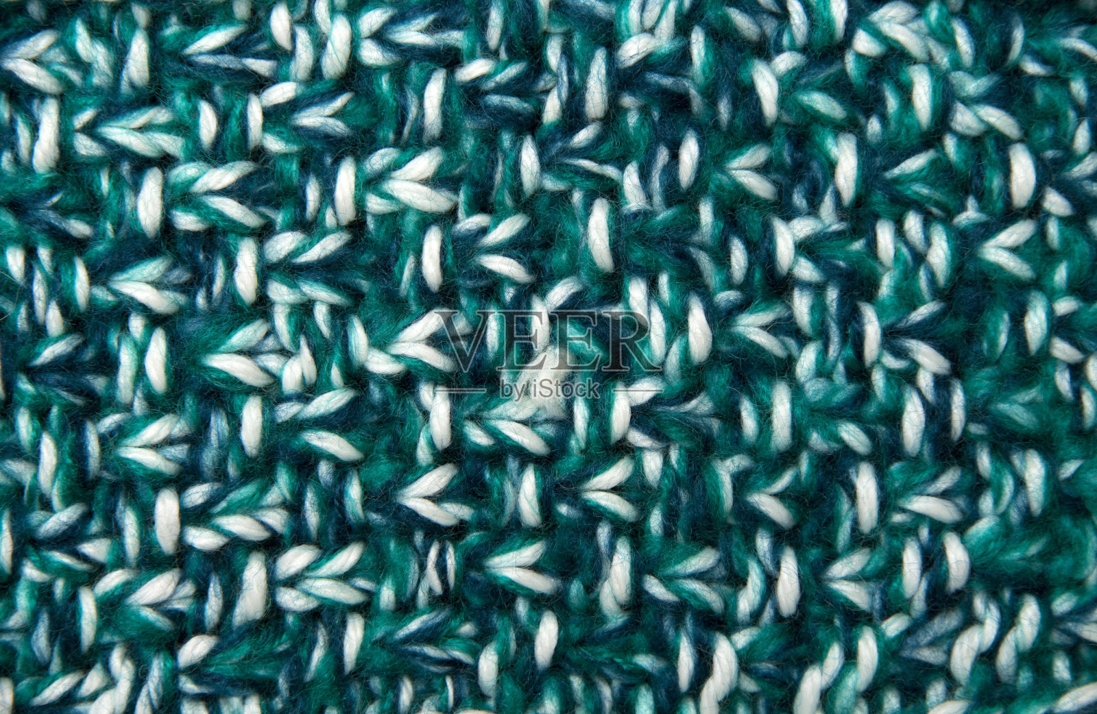 绿色针织背景的近景照片摄影图片