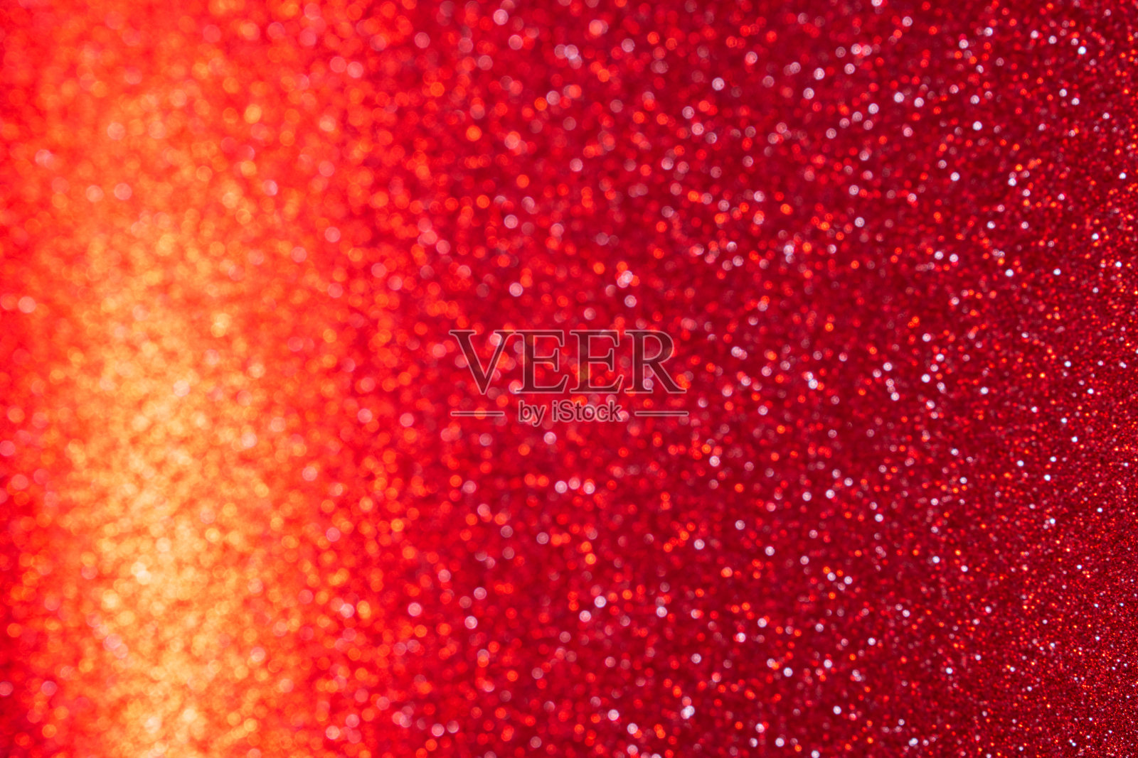 闪亮的红色散焦闪光背景。照片摄影图片