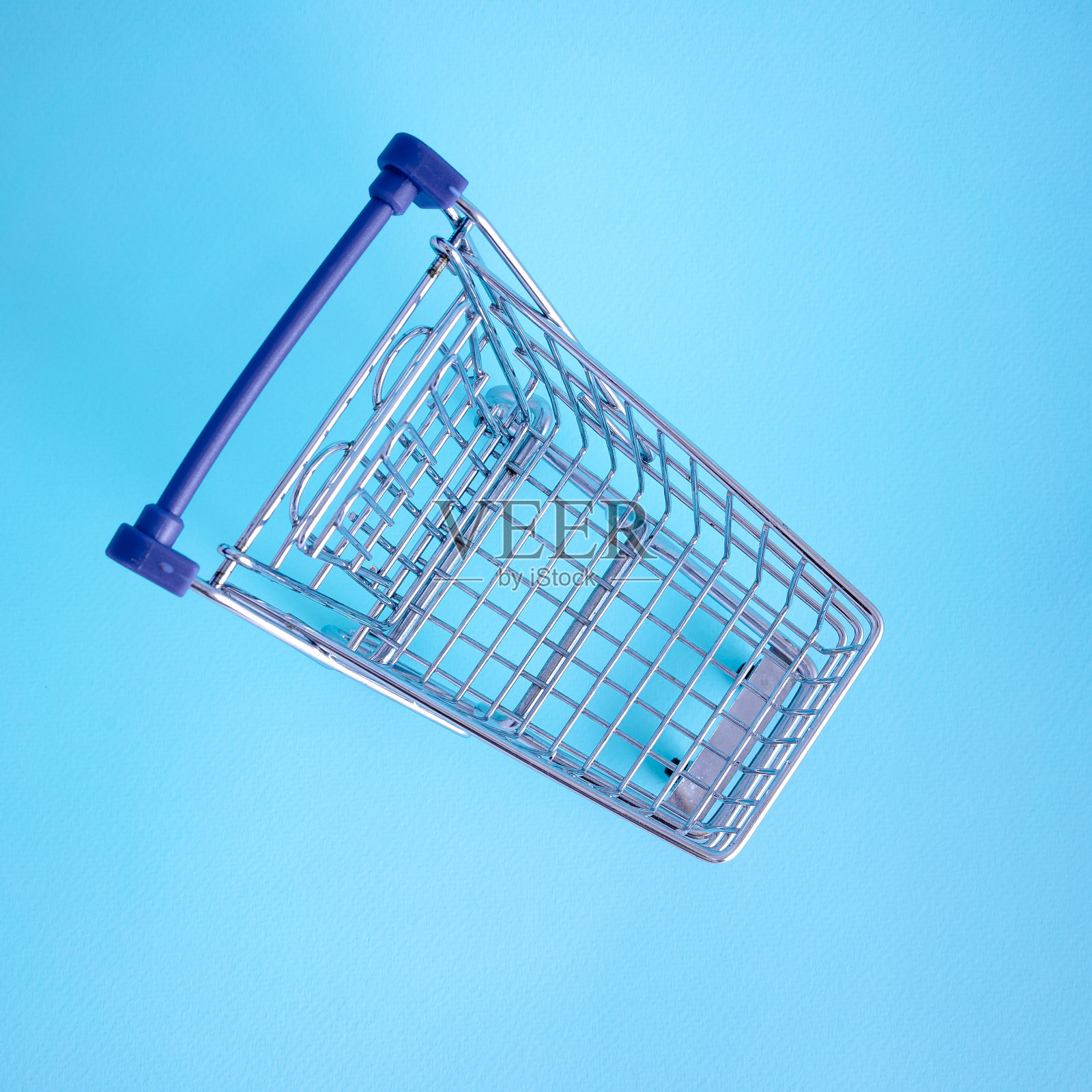 在彩色背景上清空购物车照片摄影图片