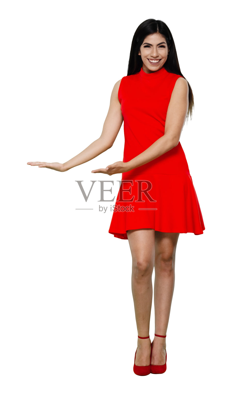 全长/正面视图/看相机/一个20-29岁的成年人美丽的黑发/长发拉丁美洲和西班牙裔种族的女性/年轻女性主持人站着穿着裙子和高跟鞋/酷的态度照片摄影图片