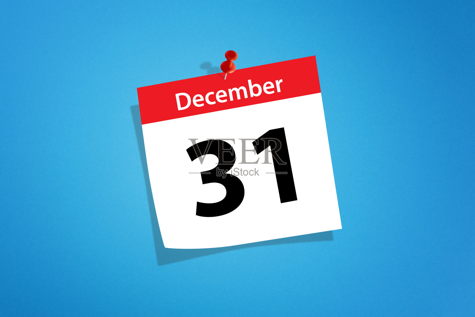 日历用红色图钉钉着12月31日除夕的概念照片摄影图片