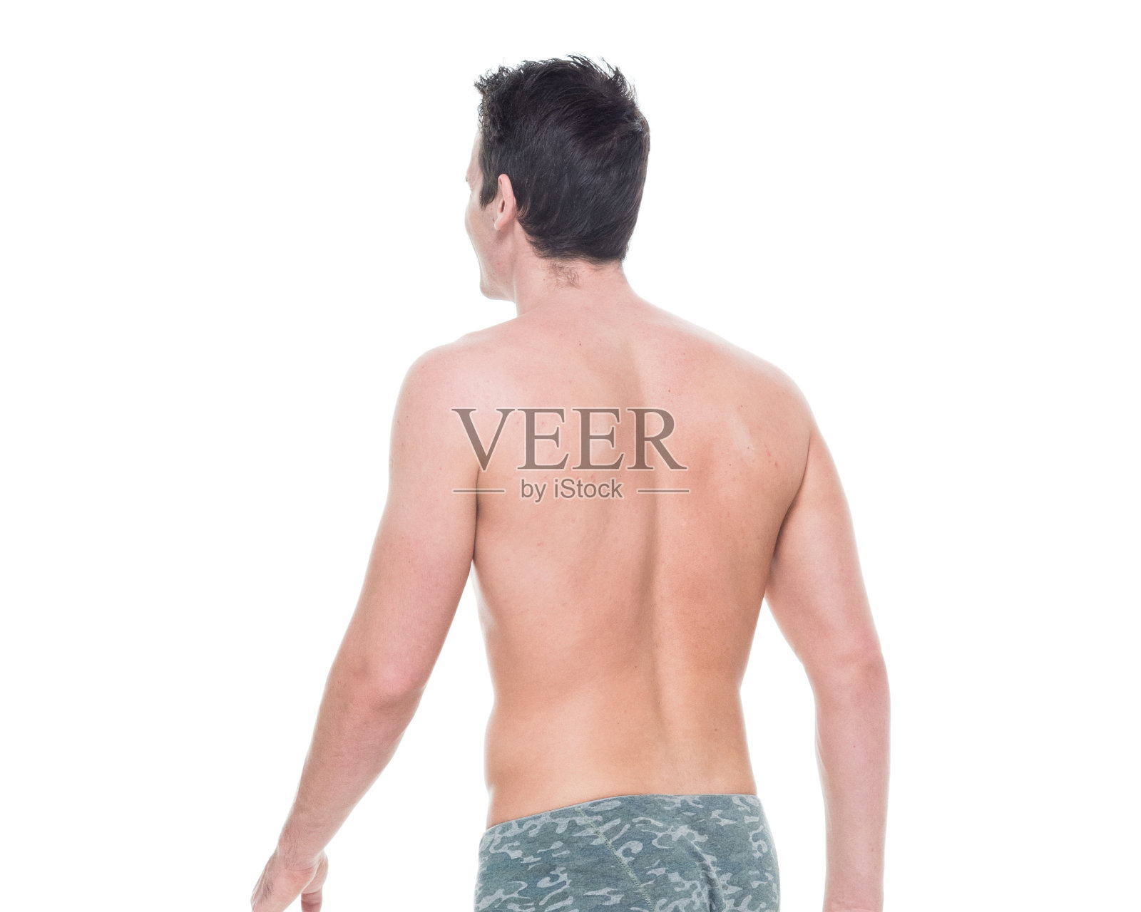 一个男人/一个人/腰部以上/ 20-29岁的成年英俊的人白人男性/年轻男子站着穿平角短裤/内衣谁是赤膊/性感的象征/酷的态度/腹肌/胸躯干照片摄影图片