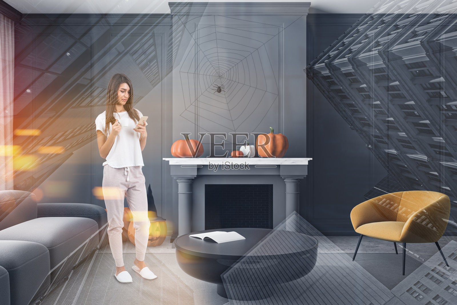 客厅里挂着万圣节装饰品的女人照片摄影图片