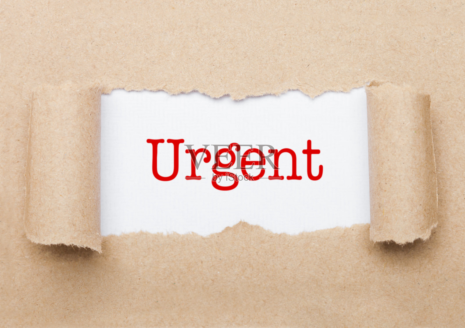 牛皮纸后面出现紧急概念文本照片摄影图片
