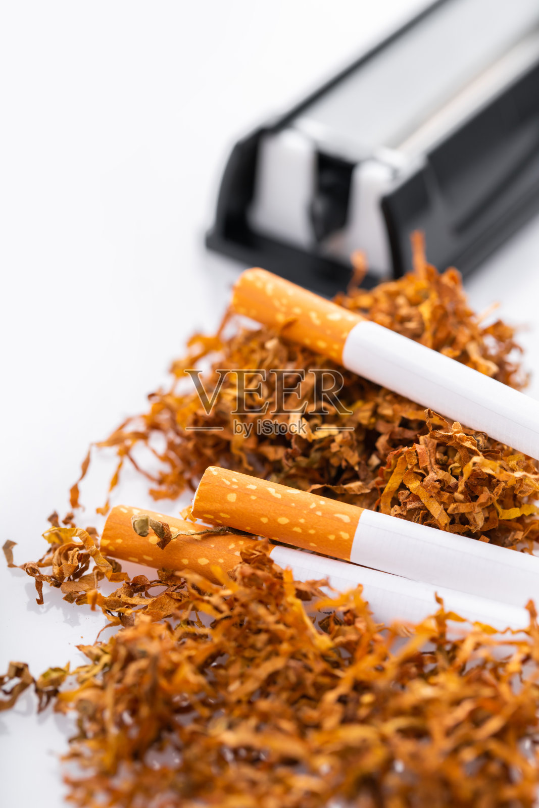 带有烟草和香烟的卷烟机照片摄影图片