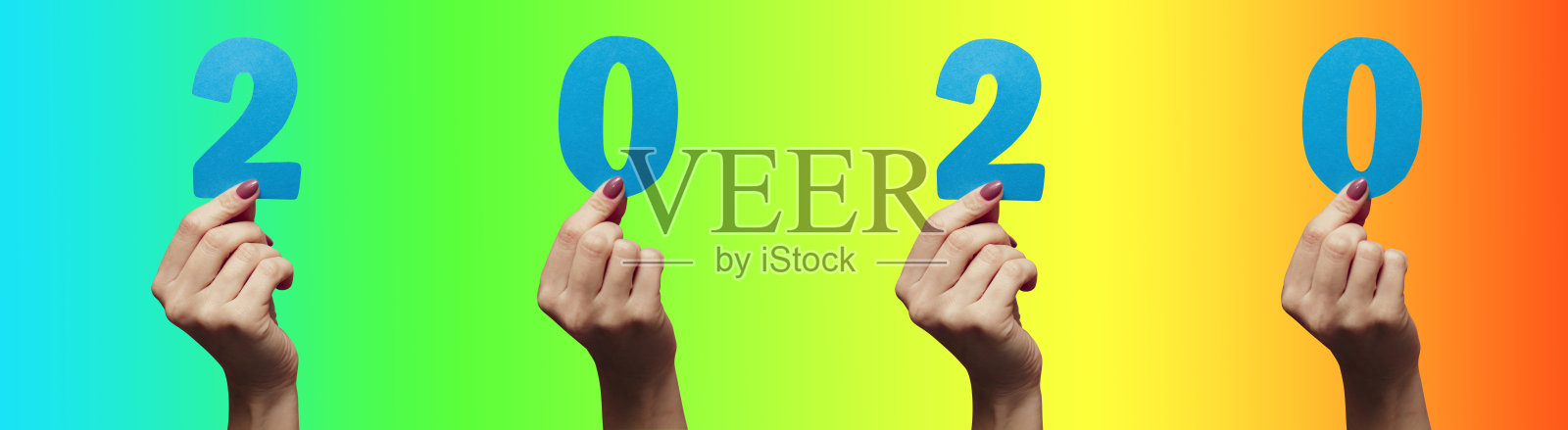 收集女性手显示日期2020剪纸彩色背景，概念乐观的愿景新年和季节，创意的想法照片摄影图片