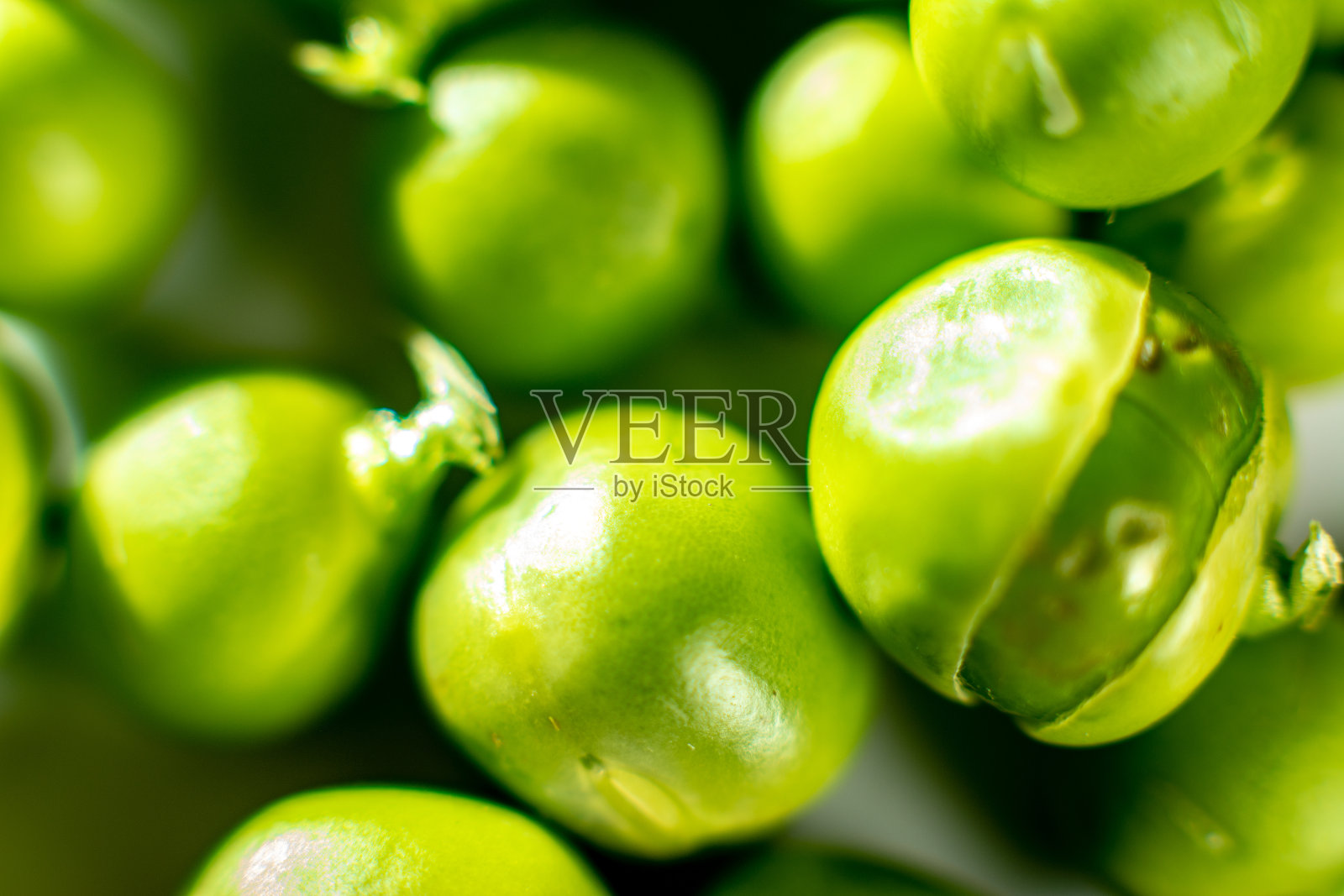 绿色豌豆的特写纹理。照片摄影图片