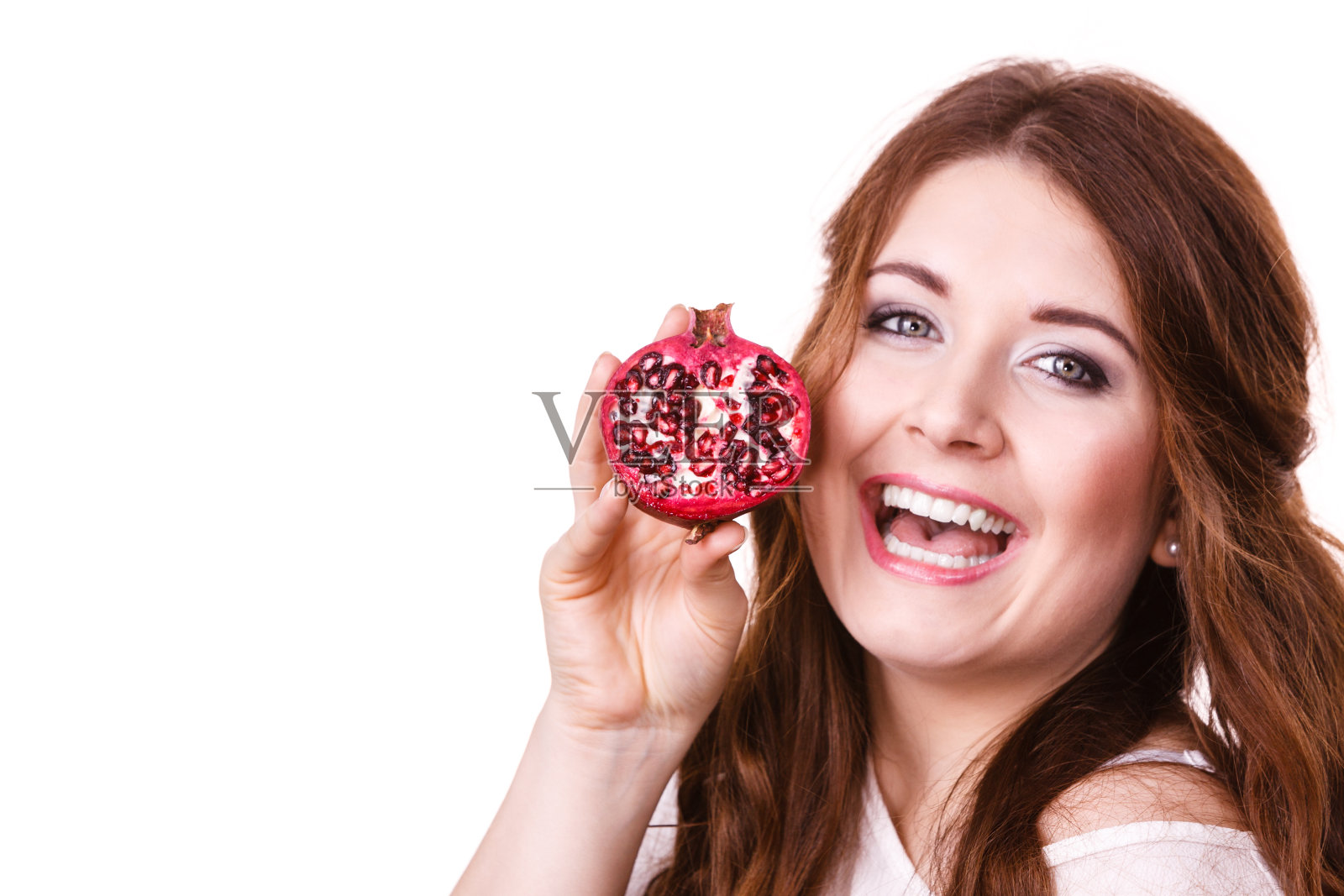 快乐的女人拿着石榴，已隔离照片摄影图片