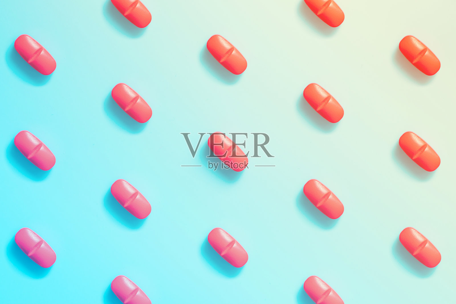 红色药丸的图案在一个彩色的背景。照片摄影图片