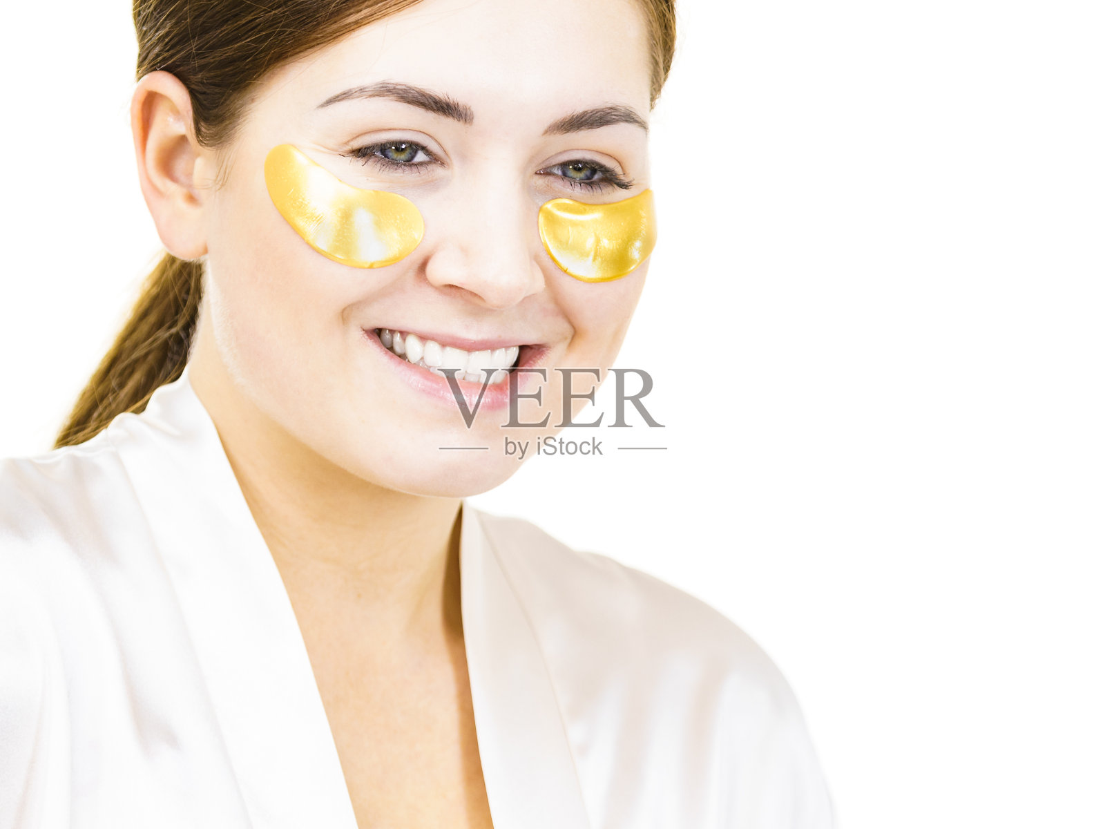 眼睛下面有金色眼罩的女人照片摄影图片