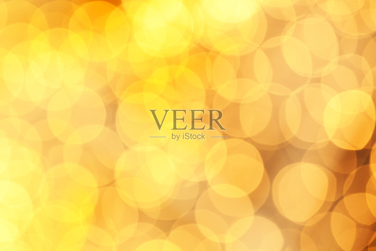 温暖闪烁的灯光，喜庆的黄色背景。抽象的金色闪烁着明亮的散景闪烁着照片摄影图片