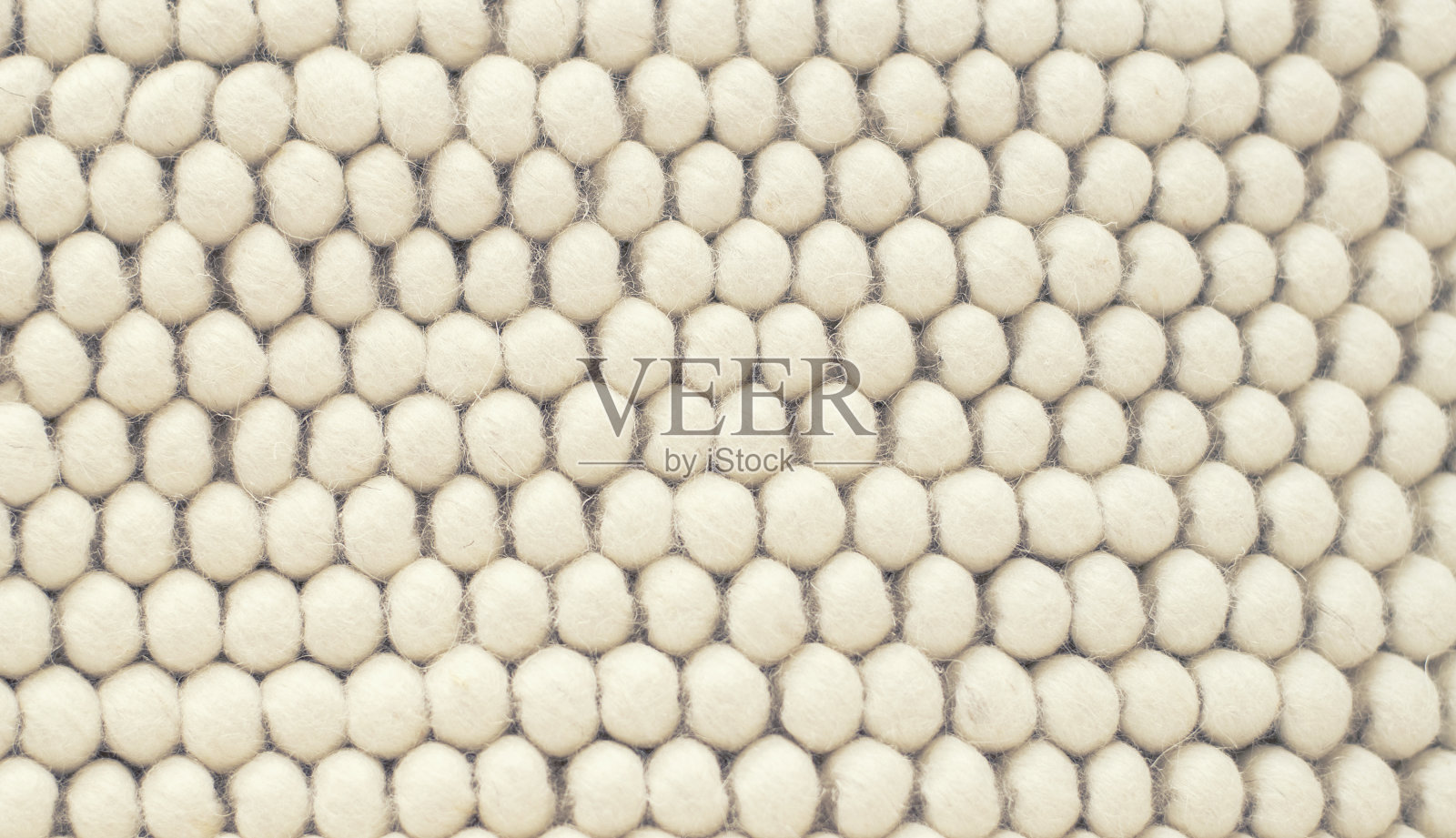 羊毛地毯的质地。手工地毯织物纹理为背景。照片摄影图片