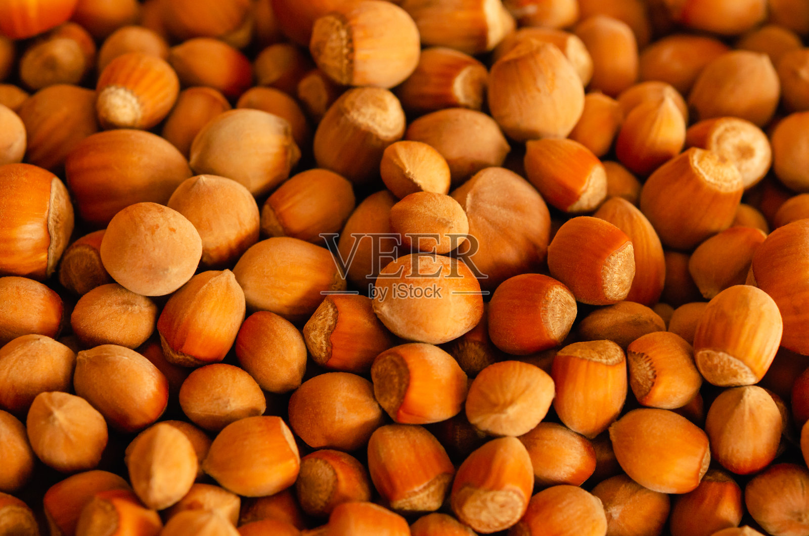 近景榛果，作为背景。榛子或小片精肉照片摄影图片